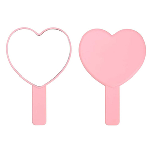 Hjerteformet dekorativt lyserødt håndholdt spejl