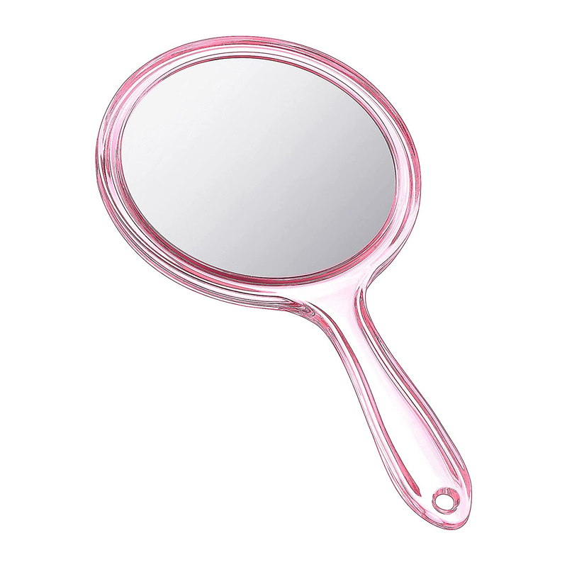 Rundt dobbeltsidet lyserødt håndholdt spejl